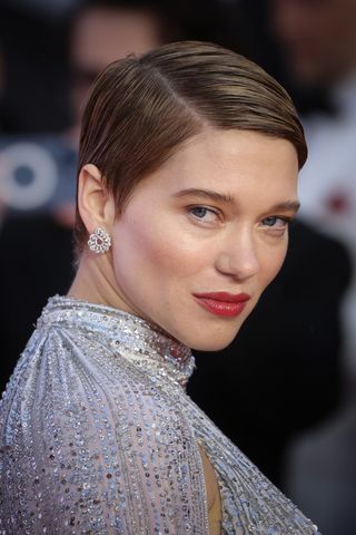 Léa Seydoux is seen with a slicked back pixie cut at the "No Time To Die" World Premiere at Royal Albert Hall on September 28, 2021 in London, England.