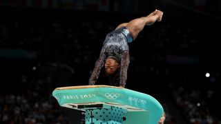 Simone Biles launches upside-down off of the vault