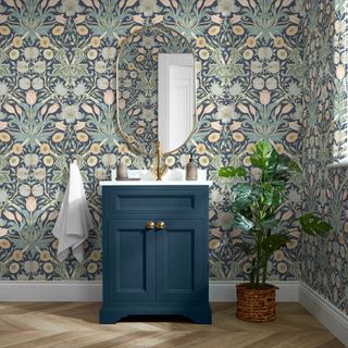 bathroom with blue and green arts and crafts style patterned wallpaper