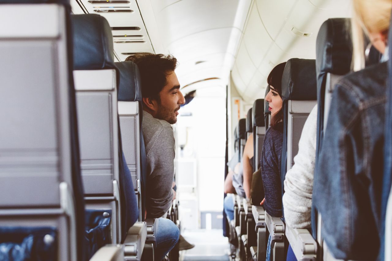 A couple on an airplane.