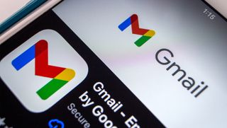 The Gmail app logo on a smartphone screen.