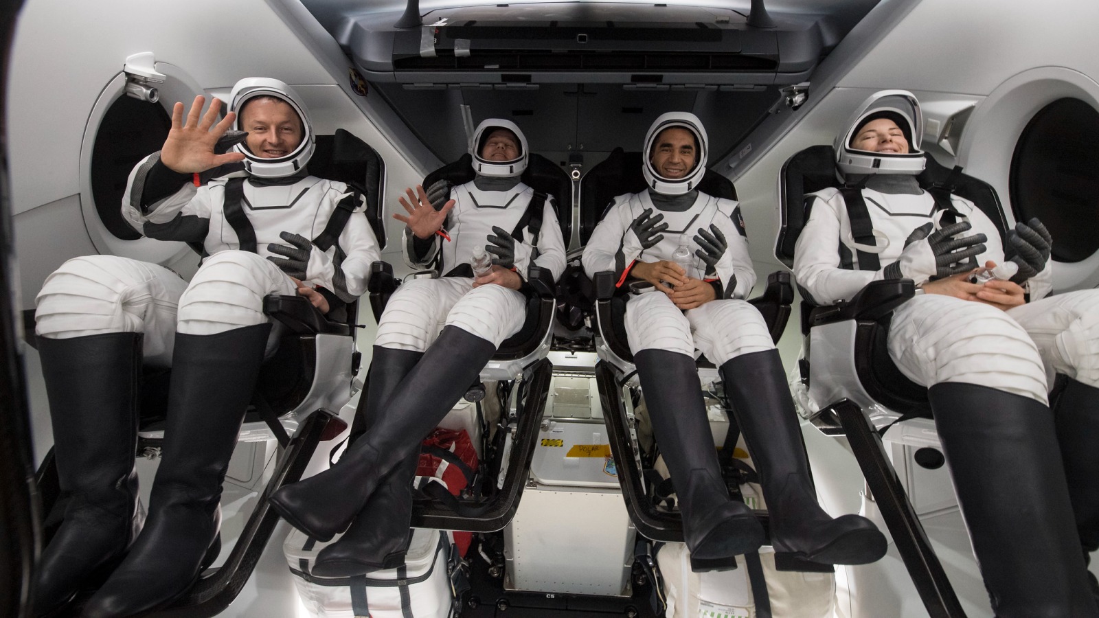 From left to right, ESA (European Space Agency) astronaut Matthias Maurer, and NASA astronauts Tom Marshburn, Raja Chari, and Kayla Barron, greet recovery officials shortly after the Crew-3 splashdown on May 6, 2022.