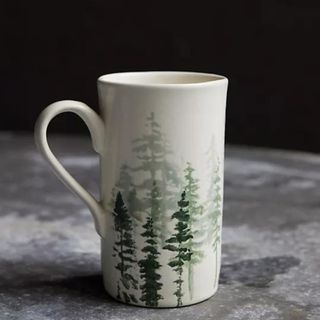 Evergreen Ceramic Mug against a gray background.