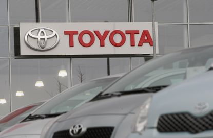 The Toyota logo at a car dealership