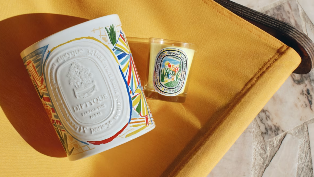 Diptyque summer candles on a yellow chair