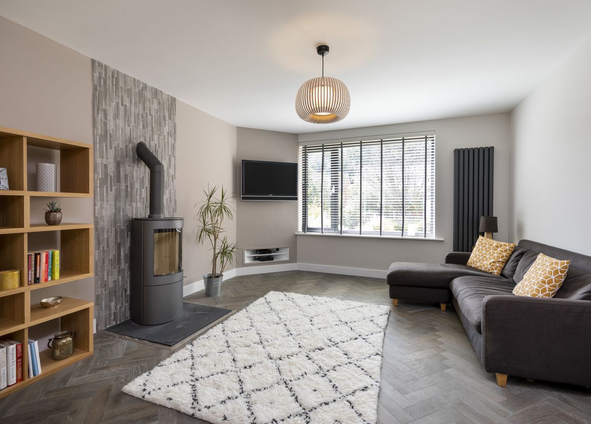 The grey palette used in the kitchen-diner has been continued in the lounge.