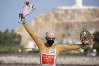 EuskatelEuskadis rider Peio Goikoetxea poses on the podium after winning the gold jersey Most aggressive rider in the 2022 Oman Tour in Muscat on February 15 2022 Photo by Thomas SAMSON AFP Photo by THOMAS SAMSONAFP via Getty Images