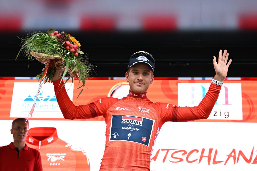 MERZIG GERMANY AUGUST 24 Ilan Van Wilder of Belgium and Team Soudal Quick Step celebrates at podium as Red Leader Jersey winner during the 38th Deutschland Tour 2023 Stage 1 a 179km stage from Sankt Wendel to Merzig on August 24 2023 in Merzig Germany Photo by Christian KasparBartkeGetty Images