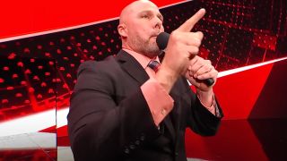 Adam Pearce lecturing a wrestler Monday Night Raw