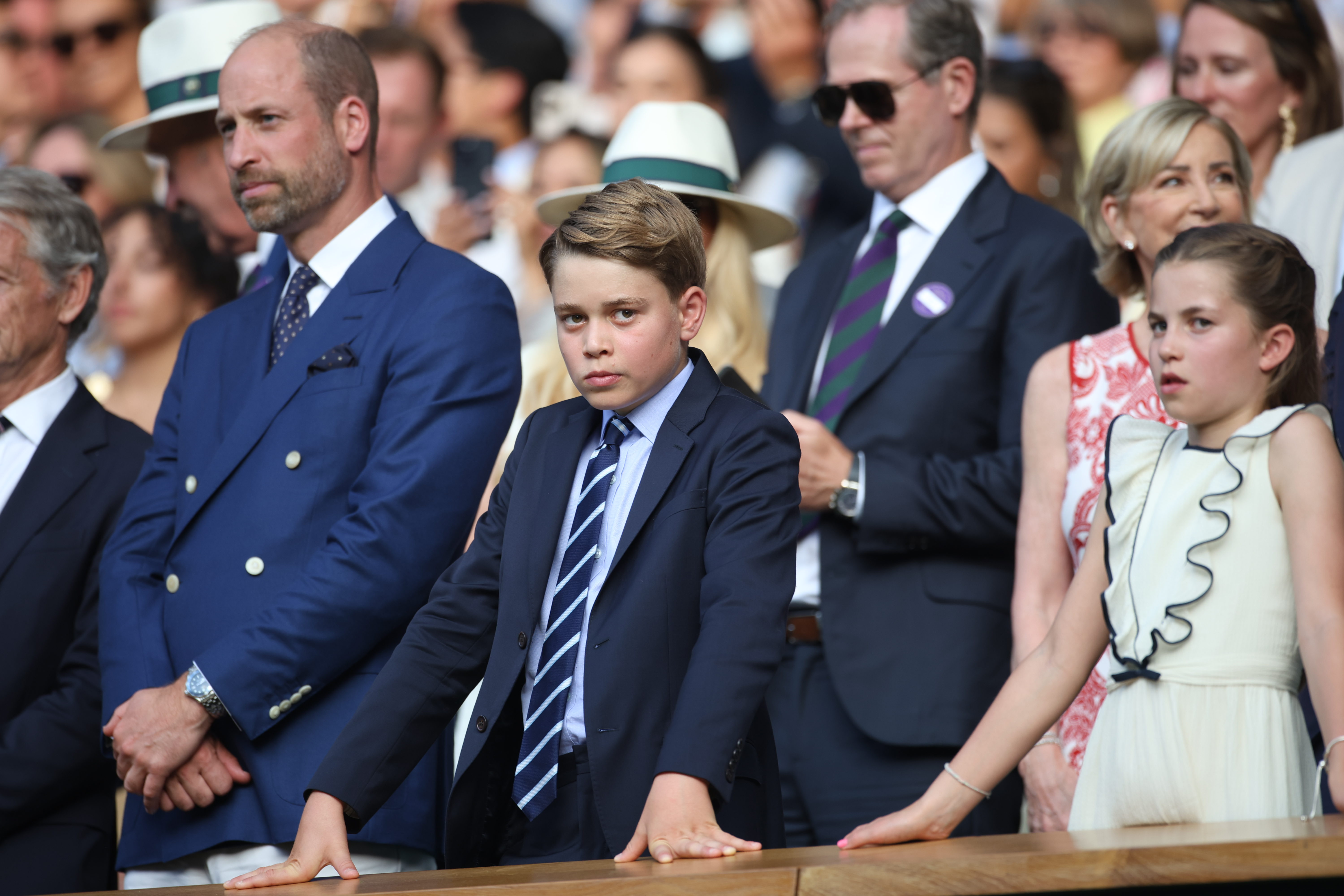 Prince George wears a suit and tie to Wimbledon on July 13 with father Prince William and sister Princess Charlotte