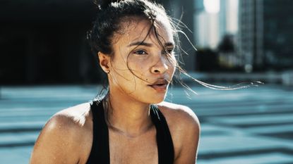 woman in black top sweating