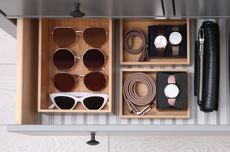 sunglasses organized in a drawer