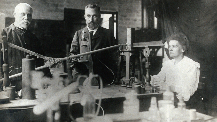 Marie and Pierre Curie (center and right) in their lab with another unidentified man.