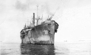 USS Missoula (APA-211), at anchor, in the transport area off Iwo Jima or Okinawa