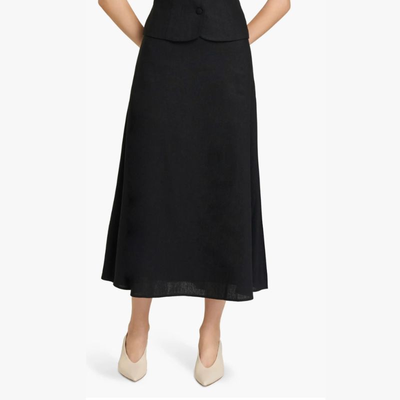 A woman wears a linen skirt from Nordstrom