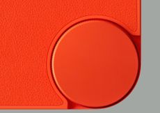 Teaser photo of bright orange dial on the CMF Phone 1