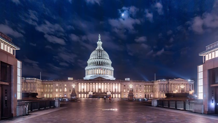 a domed white building at night