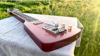 Burls Art made a lap steel out of 1,600 dollar tokens for defunct US retailer RadioShack