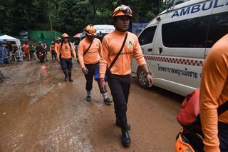 Rescue workers are seen at the Tham Luang cave area on July 8, 2018; this morning, divers entered the cave complex on a risky mission to extract the team, one by one.