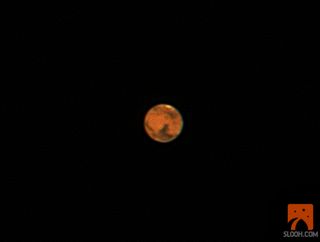 This still from a Slooh Space Camera webcast shows Mars as it appeared at opposition on March 3, 2012 at 11:30 p.m. ET (0430 GMT on March 4).