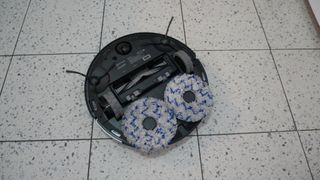 Ecovacs Deebot X1 Turbo upside down, showing mopping pads
