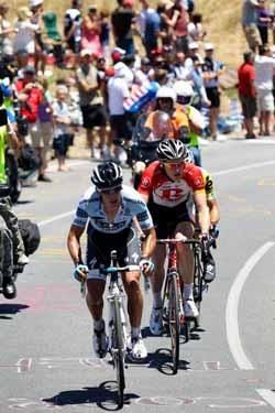 Richie Porte leads in front of a huge crowd.