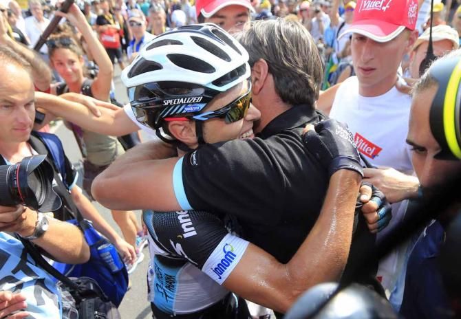 Matteo Trentin (Omega Pharma-Quick Step) gets a hug after his win