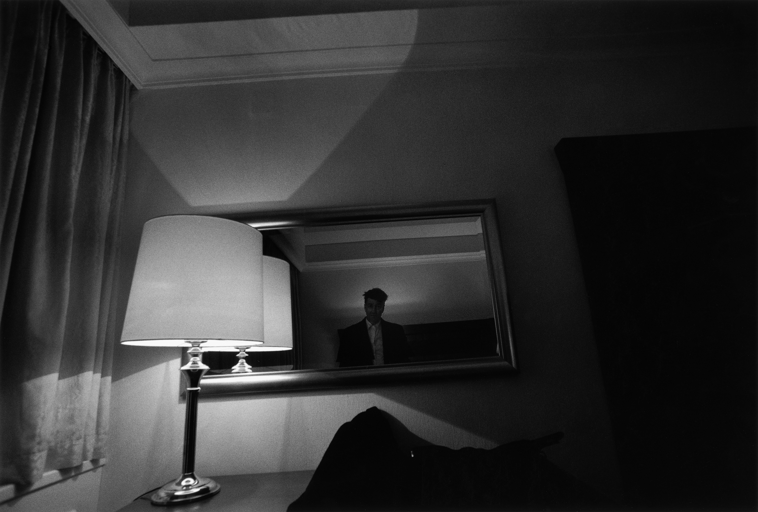 Black and white photograph by David Lynch, with the director seen reflected in a mirror