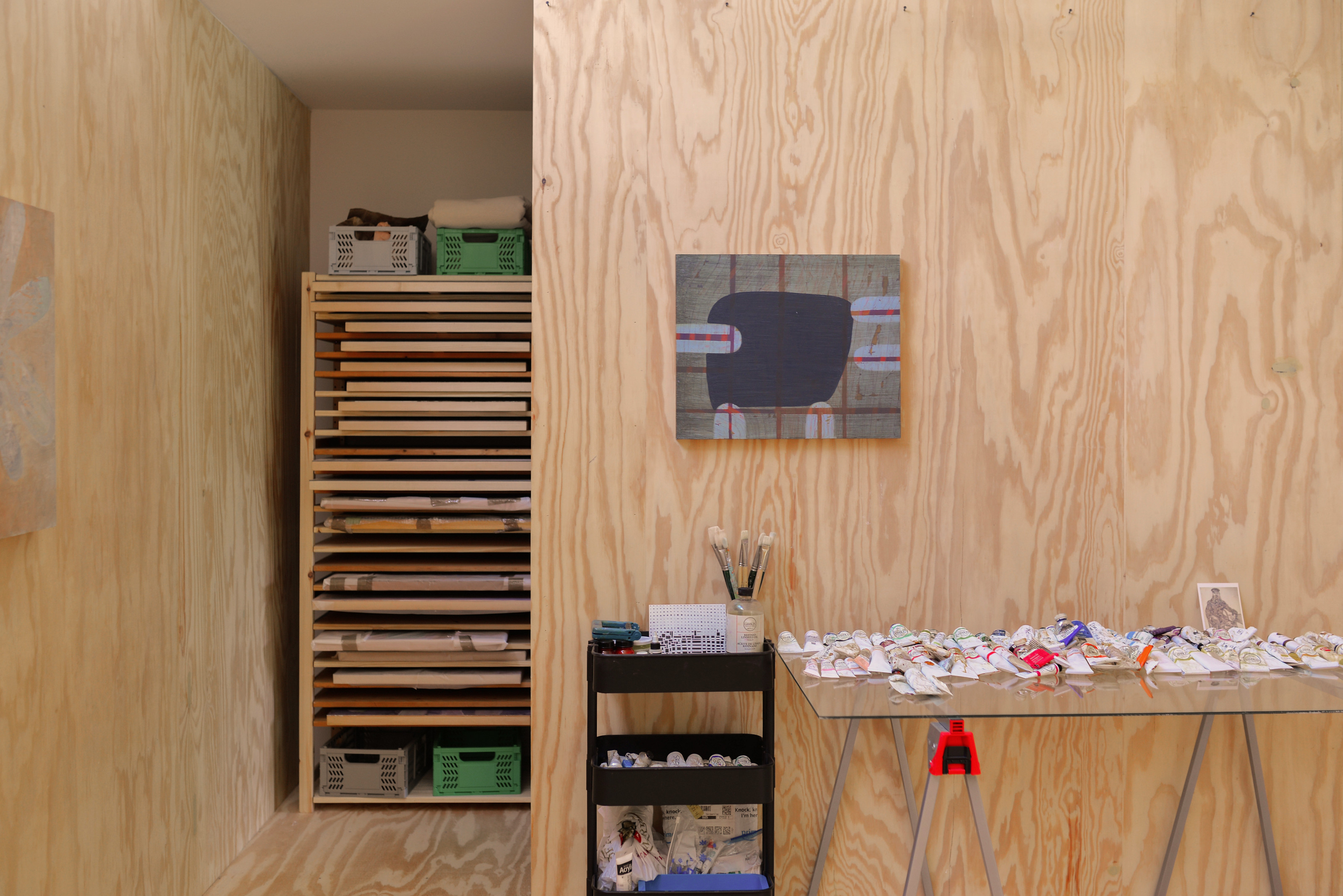 The studio incorporates storage space in addition to the main work area