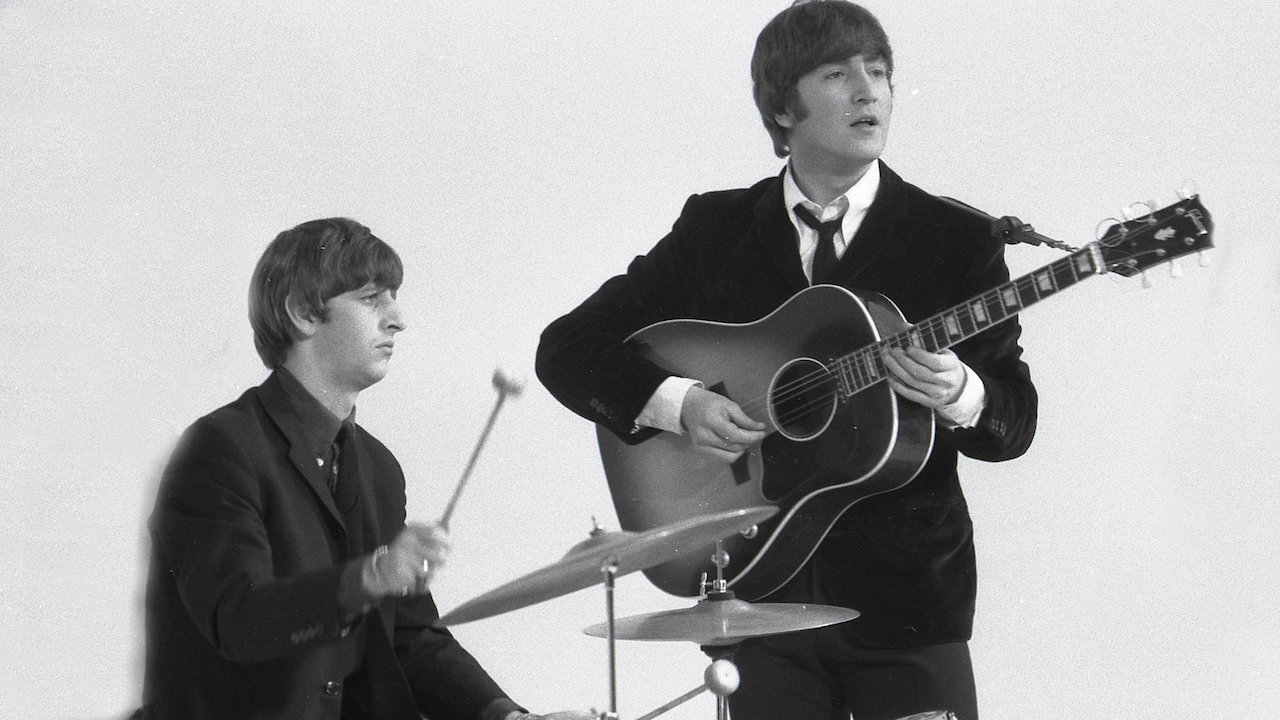 Ringo Starr & John Lennon (playing Gibson J160E acoustic guitar) performing during the filming of "A Hard Day's Night", at the Scala Theatre 
