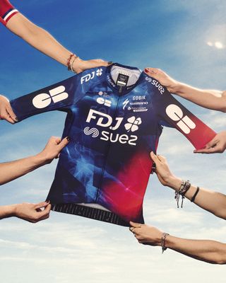 FDJ-Suez's new jersey, held by four different riders