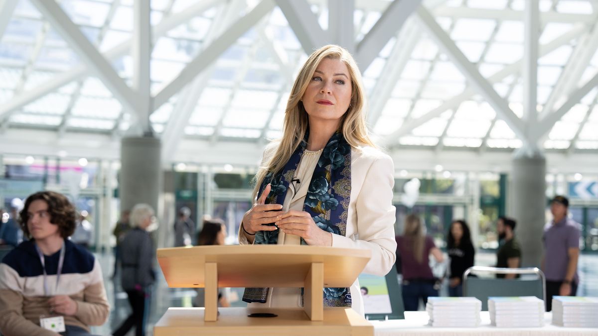 Ellen Pompeo as Kristine Barnett at a podium in Good American Family