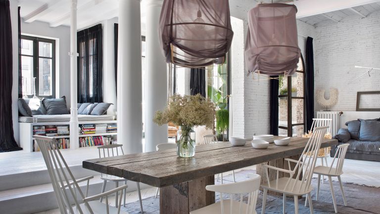 Open plan dining space with fabric lanterns above table