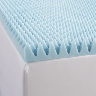 A blue gel memory foam mattress topper on top of a white mattress