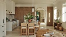 Rustic wood and wood kitchen with a large kitchen island with seating 