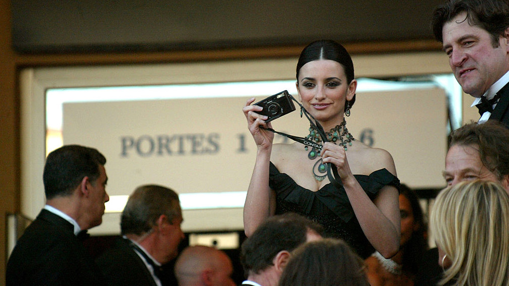 Actress Penelope Cruz snaps a picture during arrivals at the opening ceremony of the 56th International Cannes Film Festival at the Palais de Festival and the premiere of &quot;FanFan La Tulipe&quot; May 14, 2003 in Cannes, France.