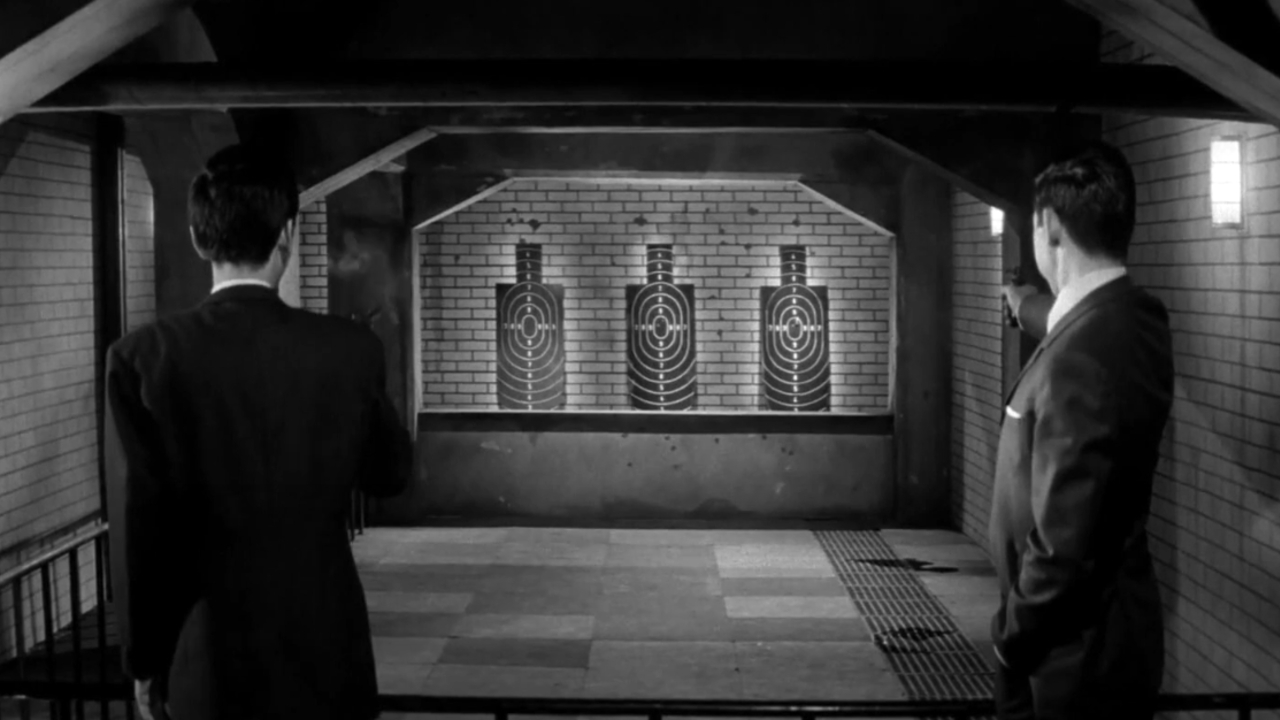 Two men at a firing range in A Colt Is My Passport