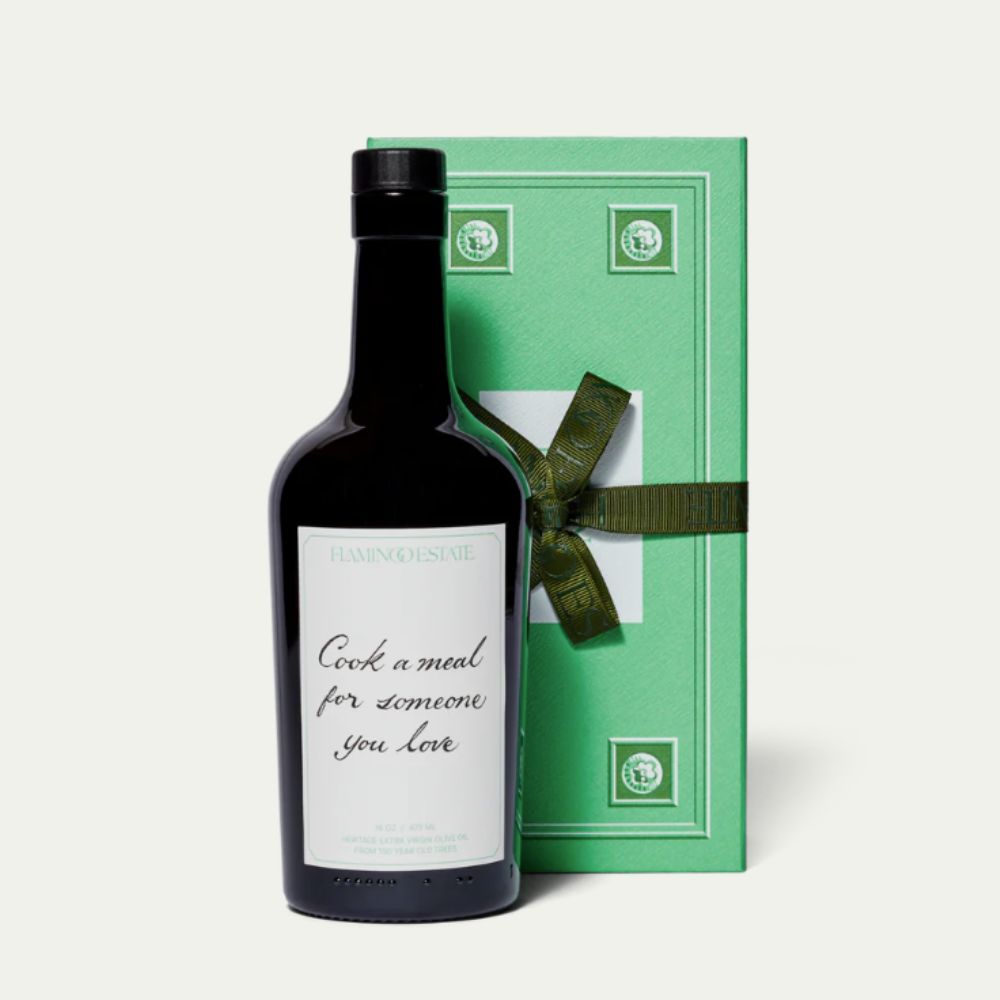 Bottle of olive oil with green presentation box and personalized label