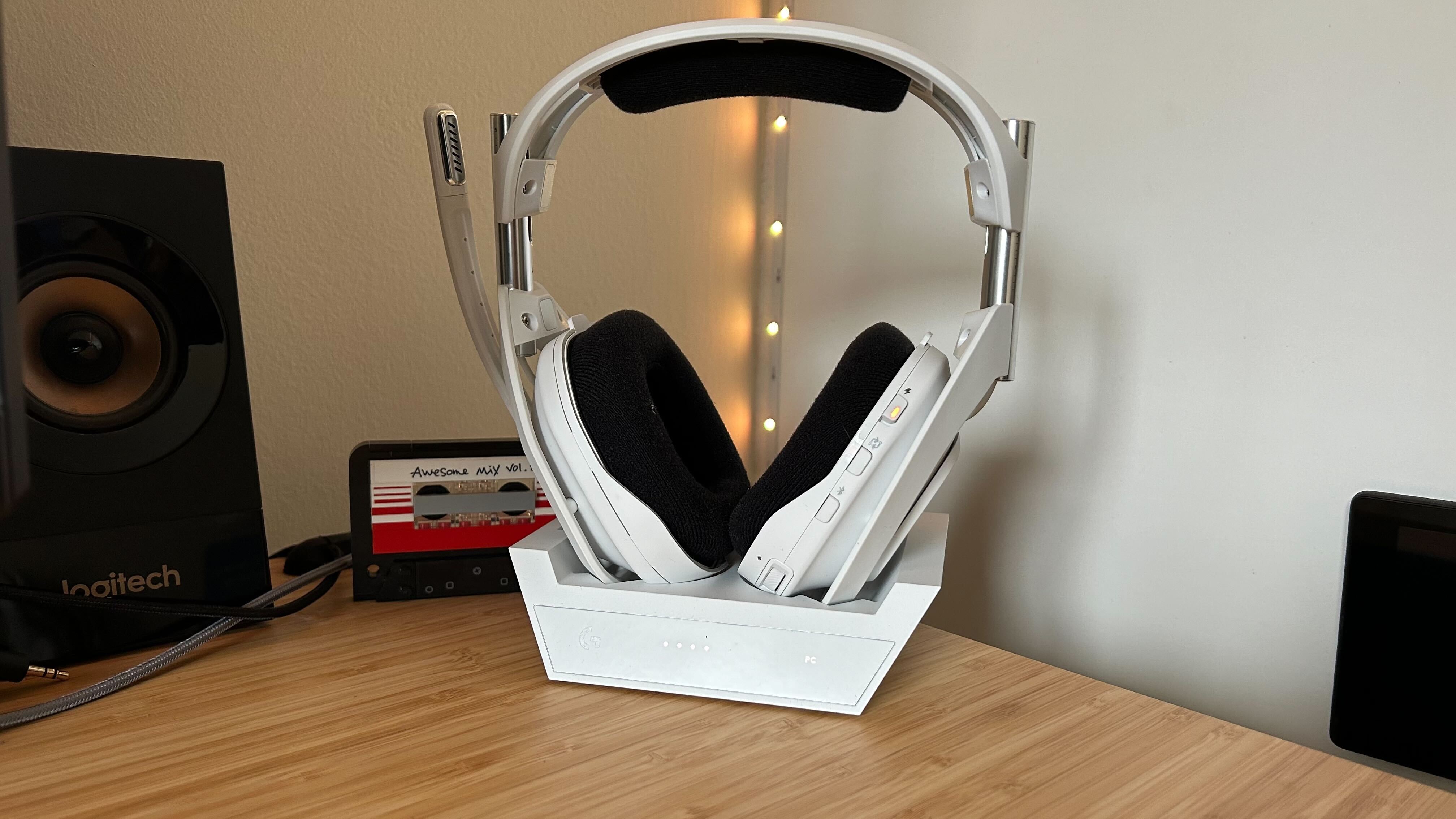 Astro A50 X headset in dock on a wooden table