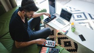 A musician uses one of the Best laptops for music production