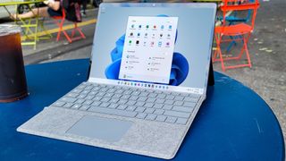 Surface Pro 8 outside on a table showing Windows 11 desktop