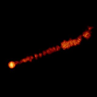 This image shows the jet in the M87 galaxy in polarized light, as captured by ALMA. This image reveals the structure of the magnetic field along the jet.