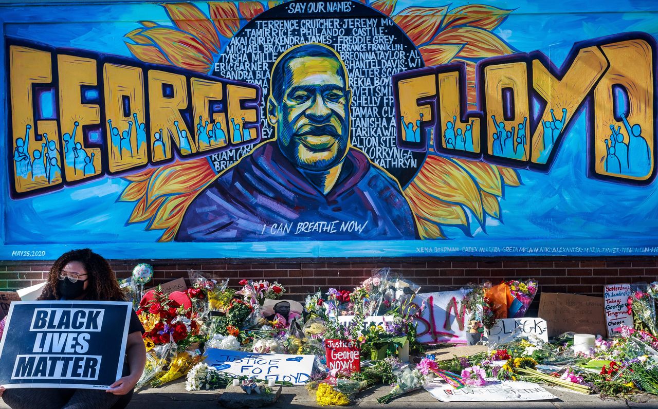 Flowers, signs and balloons are left near a makeshift memorial to George Floyd near the spot where he died while in custody of the Minneapolis police, on May 29, 2020 in Minneapolis, Minnesota.