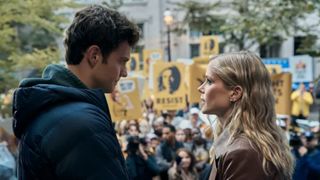 Jack Quaid as Hughie and Erin Moriarty as Starlight in front of a large crowd during The Boys.