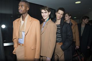 Three male models wearing Paul Smith clothing