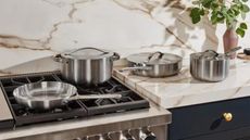 Caraway stainless steel pots and pans on stove-top