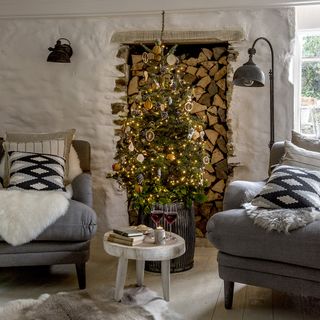 Rustic living room with grey armchairs and Christmas decorations