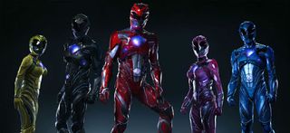 Power Rangers stand together in their suits