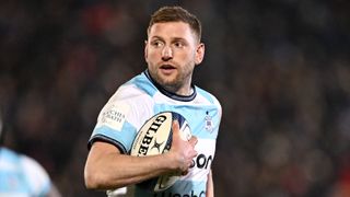Finn Russell carrying the ball for Bath Rugby in the Investec Challenge Cup.
