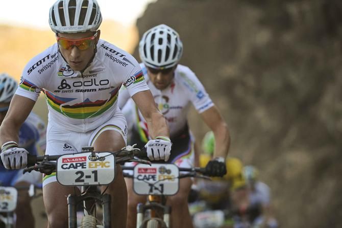 Nino Shurter of Team Scott-Swisspower MTB-racing leads Christoph Sauser of Team Burry Stander - Songo up the the first climb